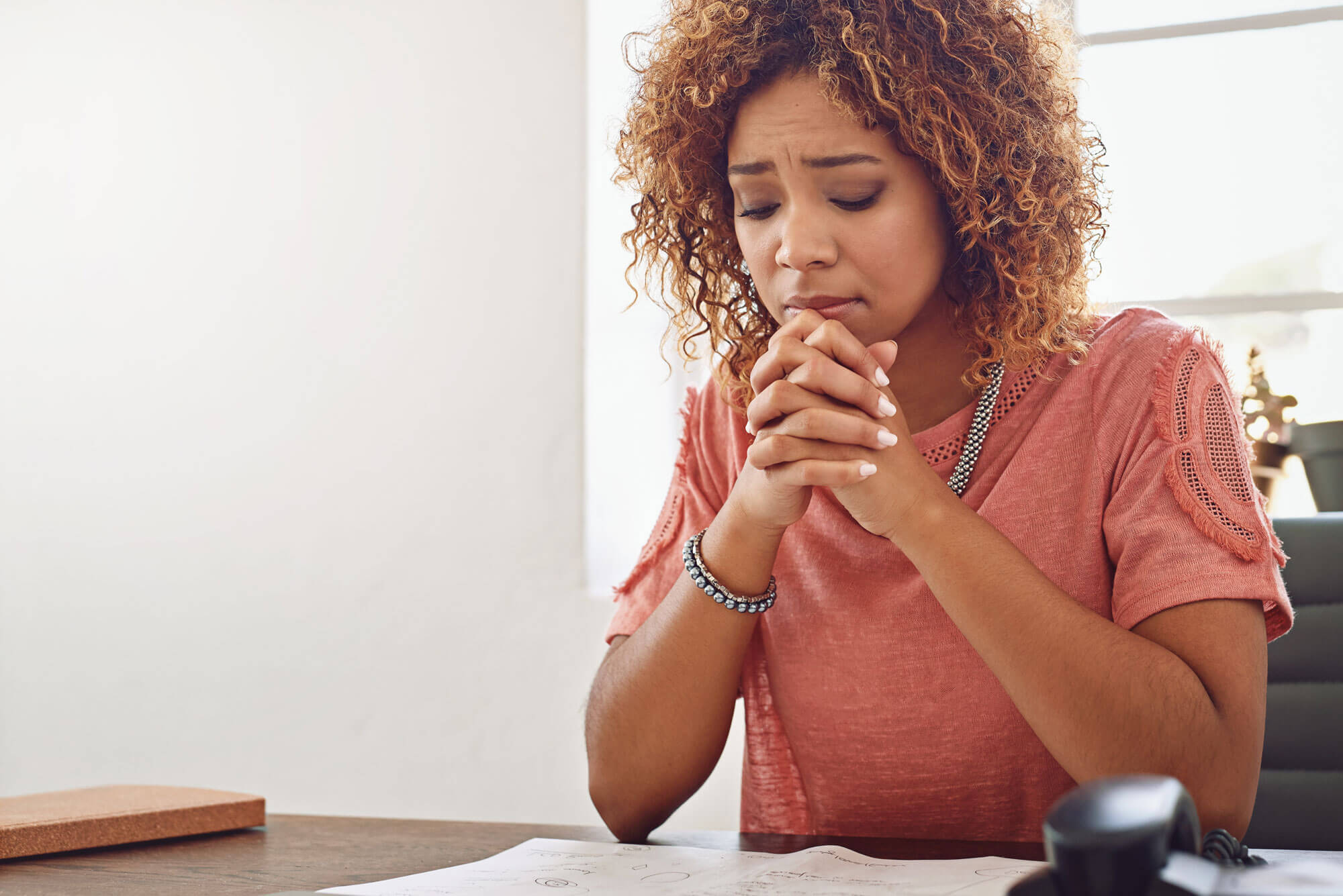 Christian woman praying with folded hands, seeking intimacy and authority after failure | Heaven Speaks